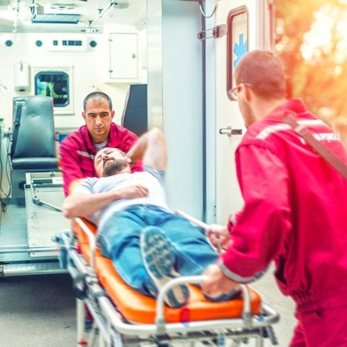 Medical emergency team helping injured man